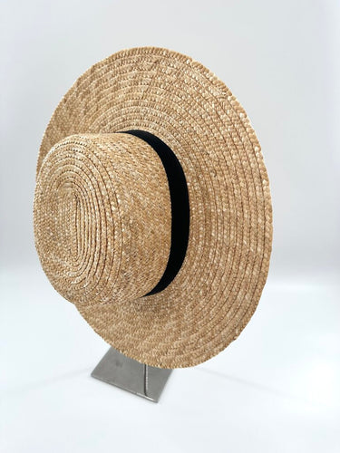 Auxiliary Aritzia straw hat with black ribbon